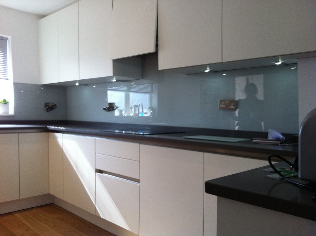 Grey glass kitchen splashback with LED lighting in Welwyn Garden City