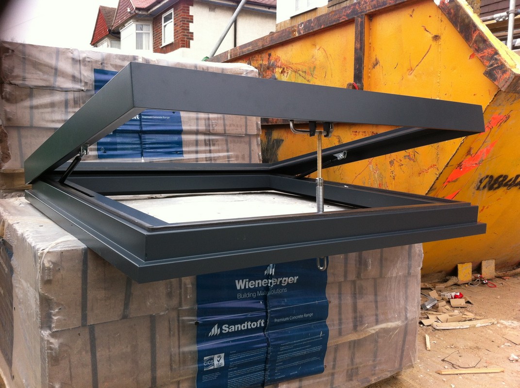 Opening flat roof skylight in anthracite grey installed in Welwyn Garden City